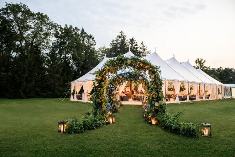 A beautiful, outdoor floral arch for a June wedding.