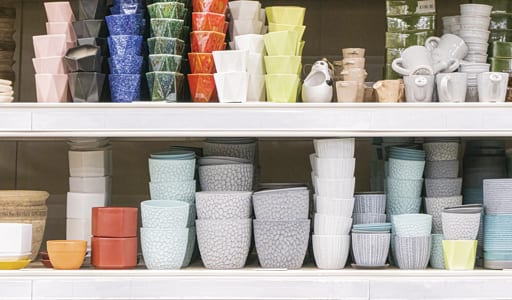 Floral containers on shelves
