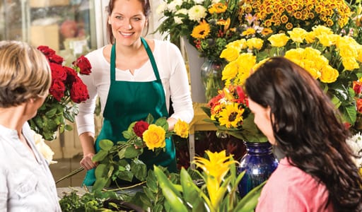 Florist arranging bouquet