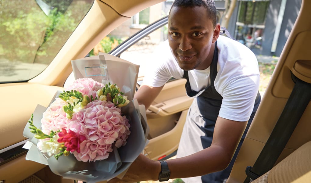 Male florist delivering flowers