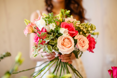 Woman holding flower bouquet