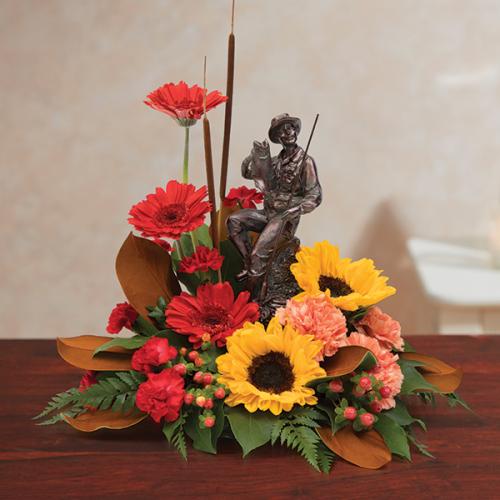 Tributes flowers and statue