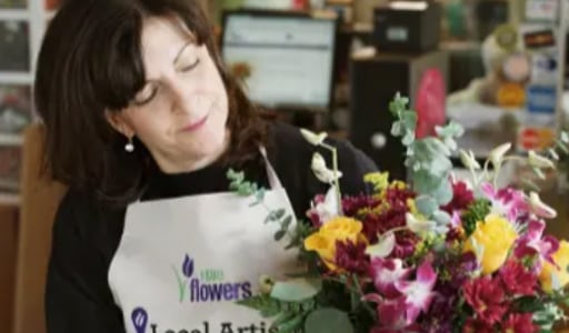 Anne Marie Pierce designing a floral arrangement