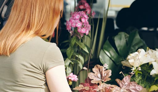 Florist prepping flowers for delivery