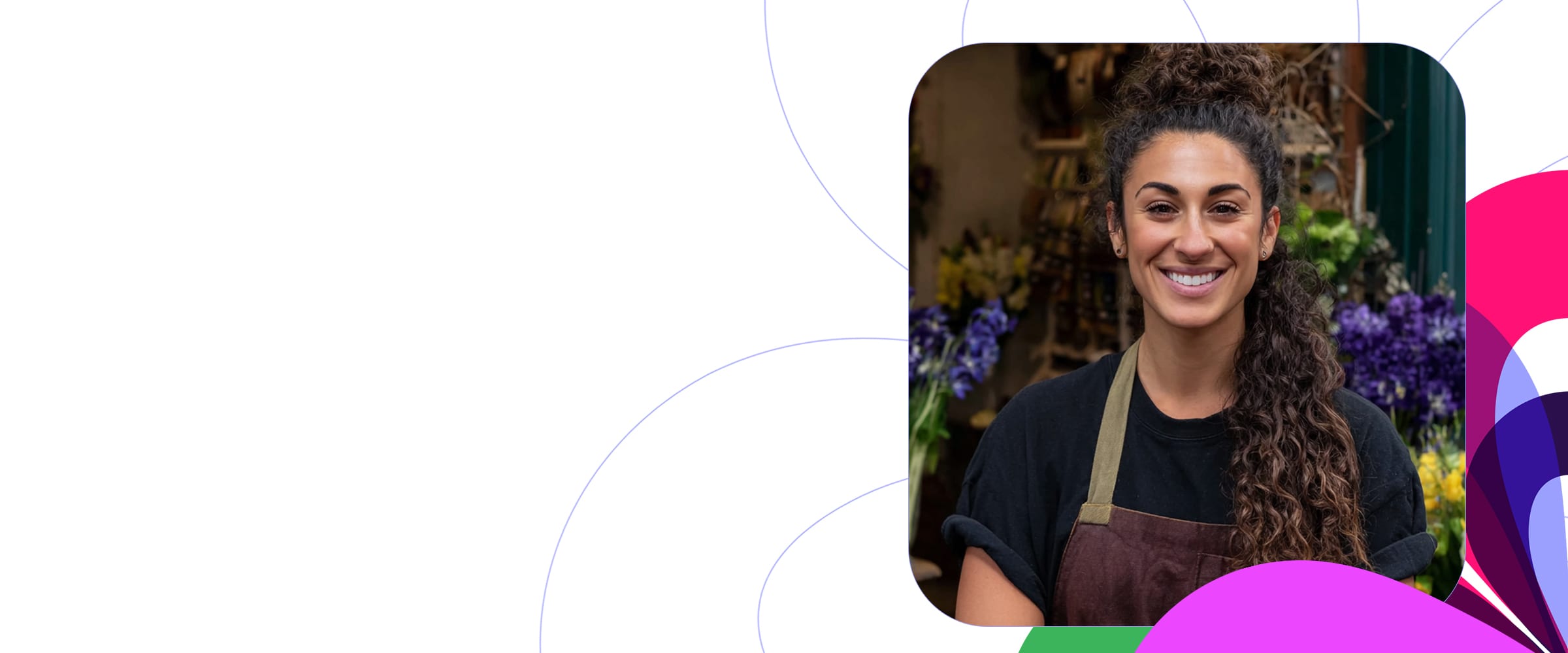 young florist in shop facing camera with multi color motif